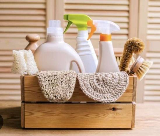 cleaning supplies in a wooden box showing natural products