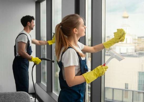 meticulous cleaning windows of a commercial building post-consturtion and before opening to the occupants and public